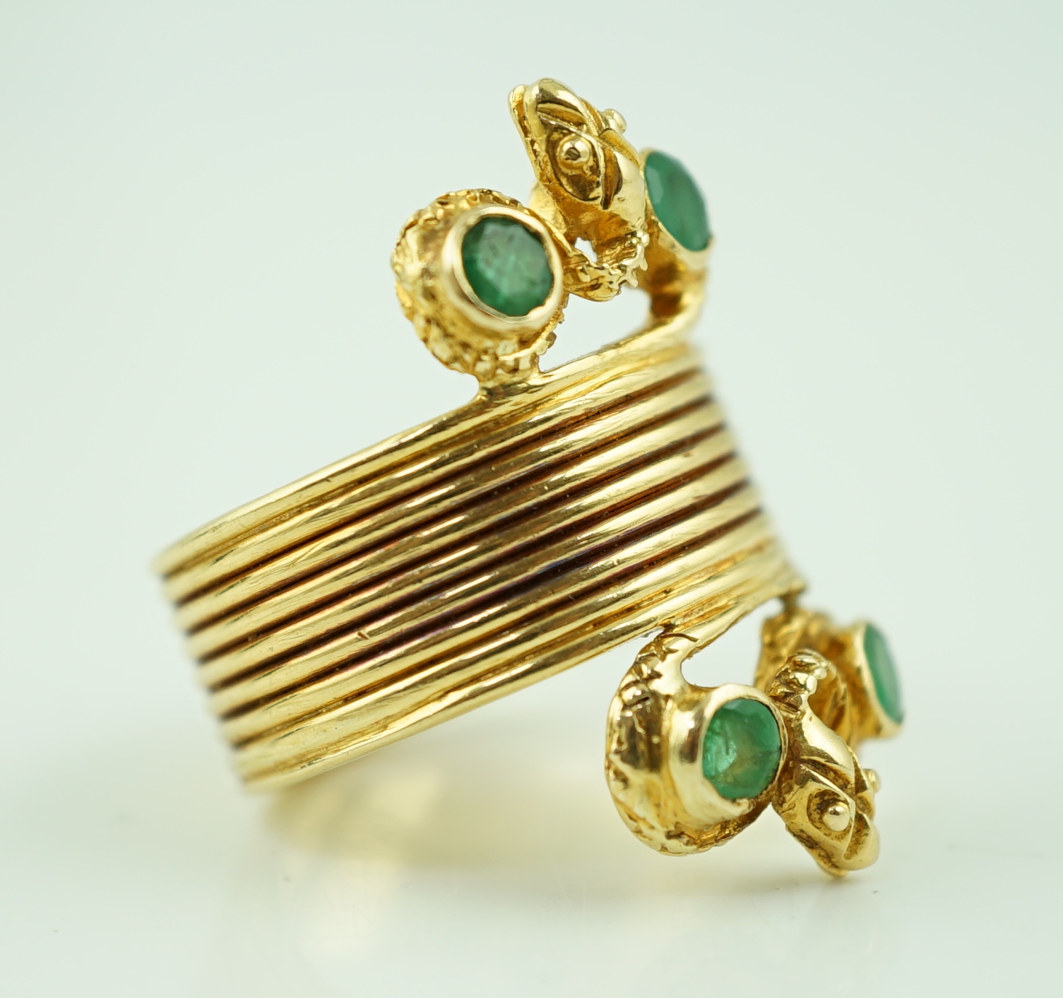 A Ilias Lalaounis 18k gold and four stone emerald set dress ring